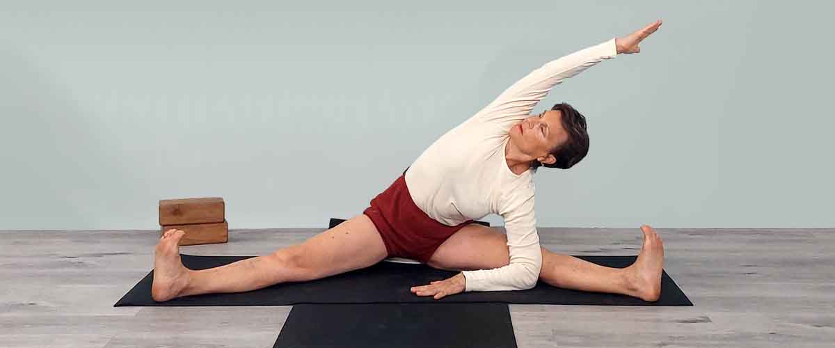 Senior Iyengar Yoga Teacher Kathy Cook demonstrate a Yoga pose