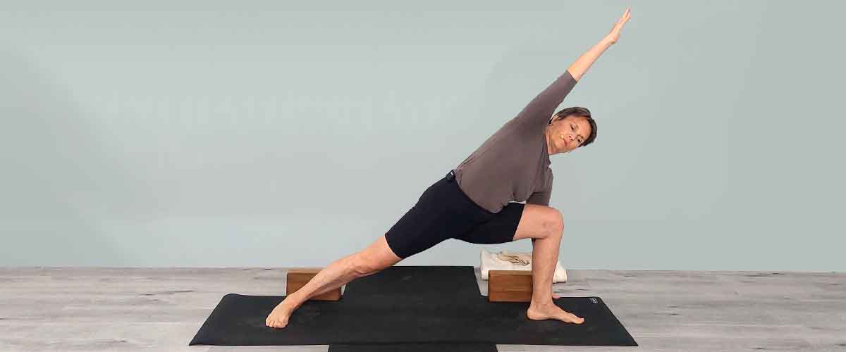 Senior Iyengar Yoga Teacher Kathy Cook demonstrate a Yoga pose