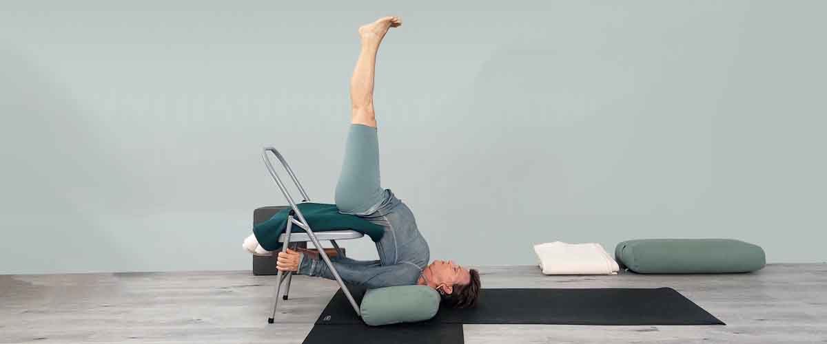 Senior Iyengar Yoga Teacher Kathy Cook demonstrate a Yoga pose