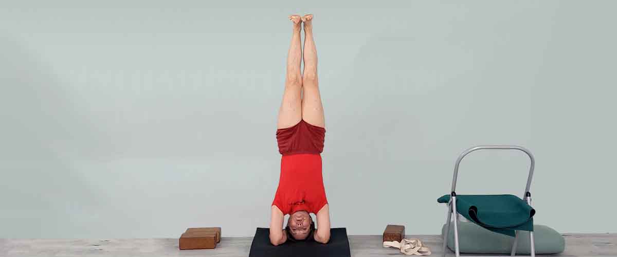 Senior Iyengar Yoga Teacher Kathy Cook demonstrate a Yoga pose