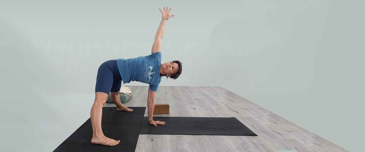 Senior Iyengar Yoga Teacher Kathy Cook demonstrate a Yoga pose