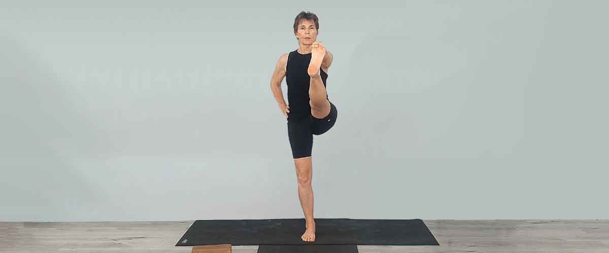 Senior Iyengar Yoga Teacher Kathy Cook demonstrate a Yoga pose