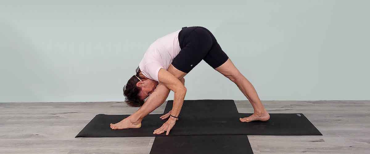 Senior Iyengar Yoga Teacher Kathy Cook demonstrate a Yoga pose