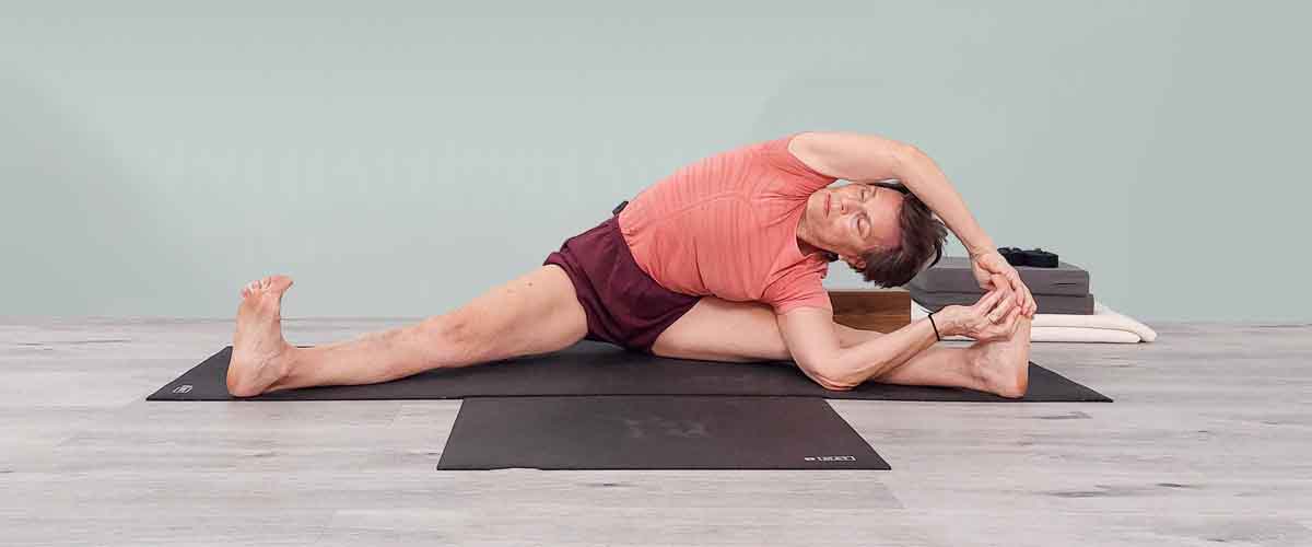 Senior Iyengar Yoga Teacher Kathy Cook demonstrate a Yoga pose