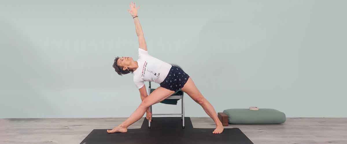 Senior Iyengar Yoga Teacher Kathy Cook demonstrate a Yoga pose