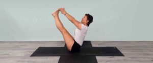 Senior Iyengar Yoga Teacher Kathy Cook demonstrate a Yoga pose