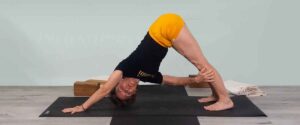 Senior Iyengar Yoga Teacher Kathy Cook demonstrate a Yoga pose