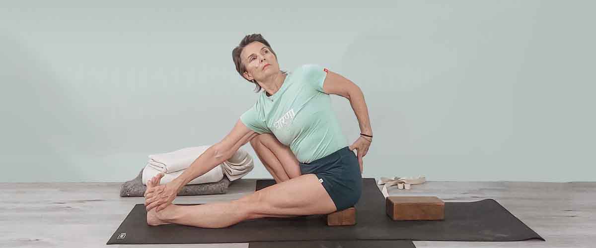 Senior Iyengar Yoga Teacher Kathy Cook demonstrate a Yoga pose