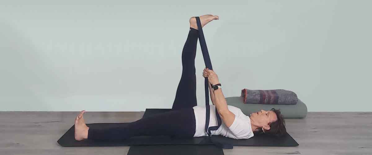 Senior Iyengar Yoga Teacher Kathy Cook demonstrate a Yoga pose
