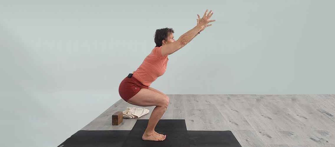 Senior Iyengar Yoga Teacher Kathy Cook demonstrate a Yoga pose