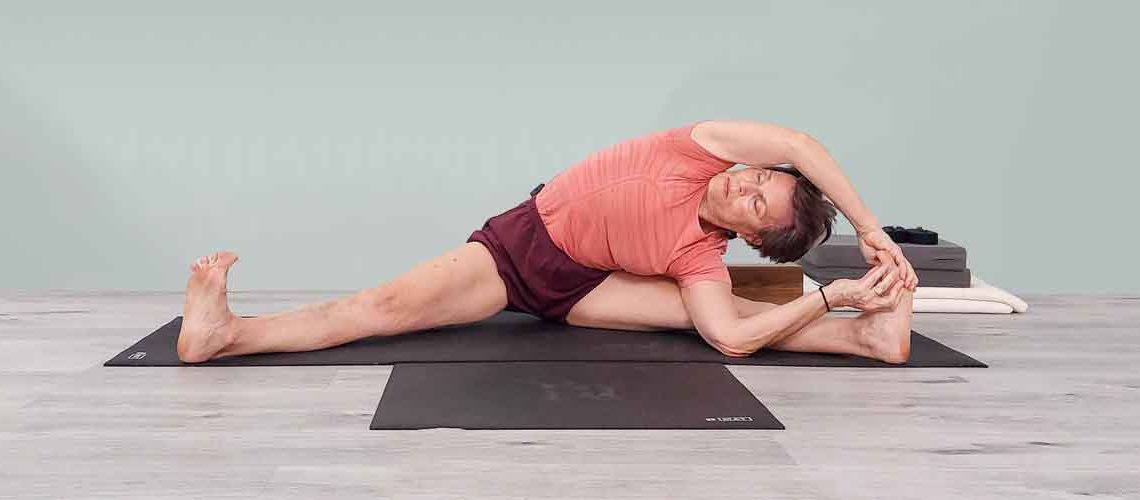 Senior Iyengar Yoga Teacher Kathy Cook demonstrate a Yoga pose