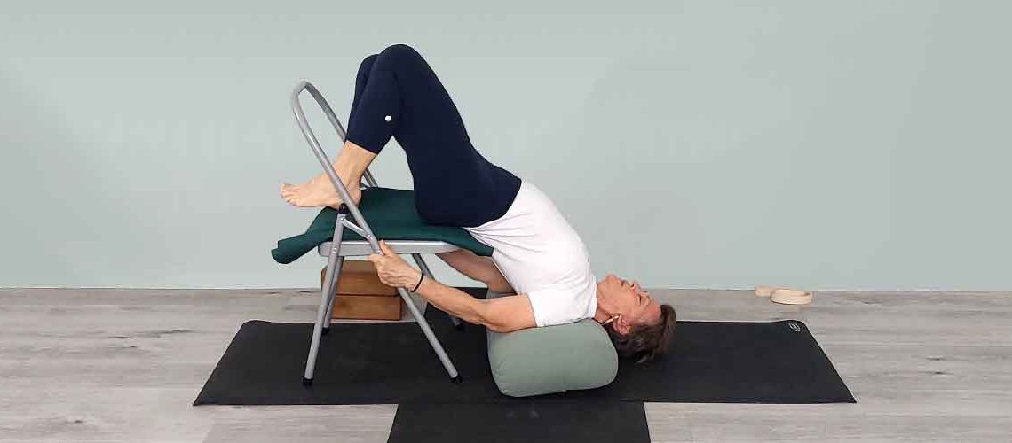 Senior Iyengar Yoga Teacher Kathy Cook demonstrate a Yoga pose