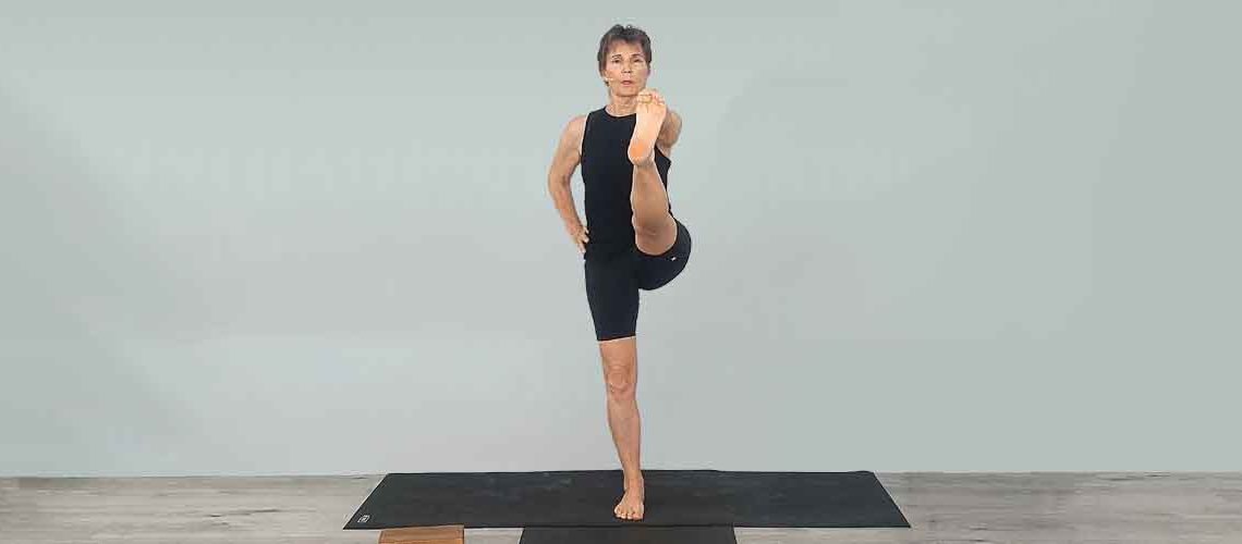 Senior Iyengar Yoga Teacher Kathy Cook demonstrate a Yoga pose