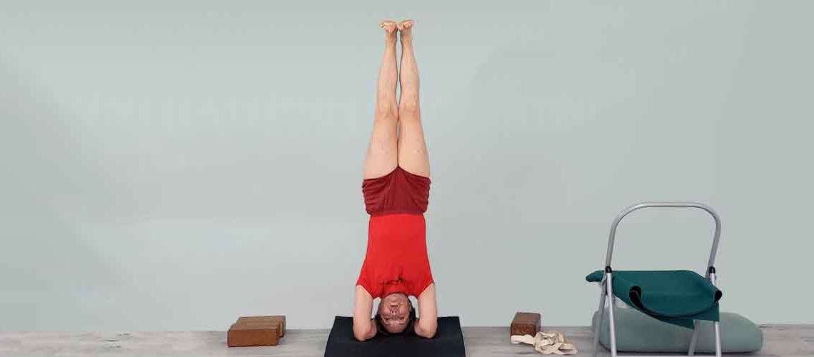 Senior Iyengar Yoga Teacher Kathy Cook demonstrate a Yoga pose