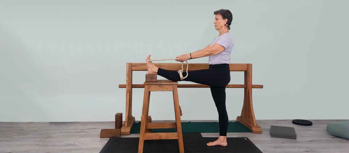 Senior Iyengar Yoga Teacher Kathy Cook demonstrate a Yoga pose