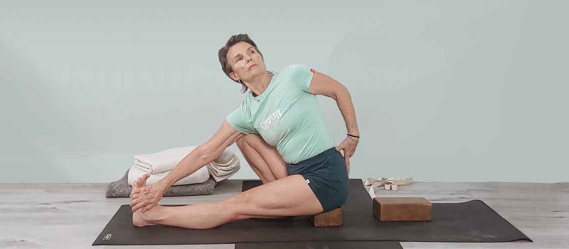 Senior Iyengar Yoga Teacher Kathy Cook demonstrate a Yoga pose