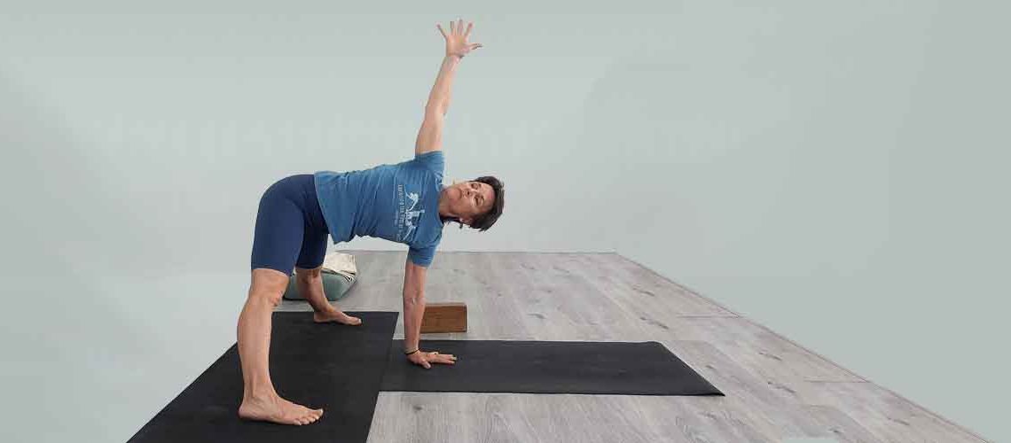 Senior Iyengar Yoga Teacher Kathy Cook demonstrate a Yoga pose