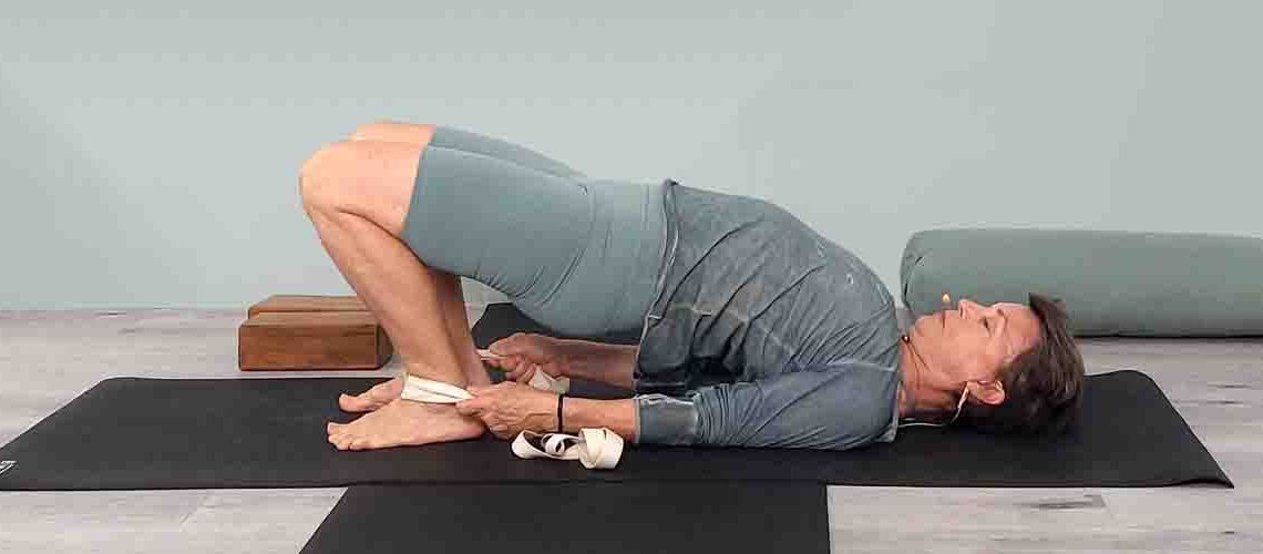 Senior Iyengar Yoga Teacher Kathy Cook demonstrate a Yoga pose