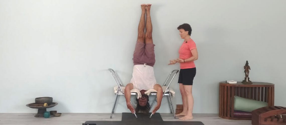 Iyengar teacher Juan Carlos demonstrating inversion