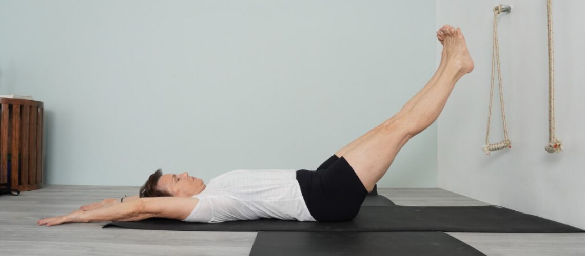 Senior Iyengar Yoga Teacher Kathy Cook demonstrate an abdominal exercise yoga