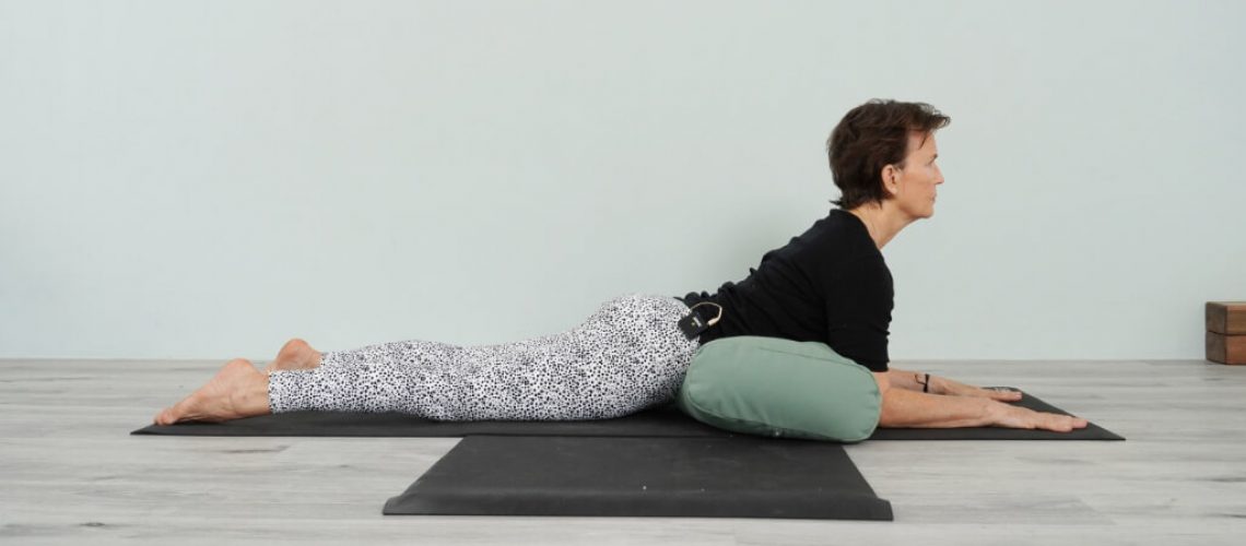 Senior Iyengar Yoga Teacher Kathy Cook demonstrate a Crocodile Pose