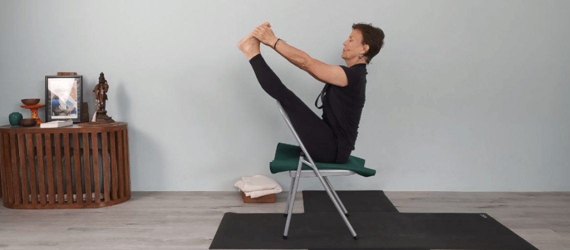 Senior Iyengar Yoga Teacher Kathy Cook demonstrate a Boat Pose